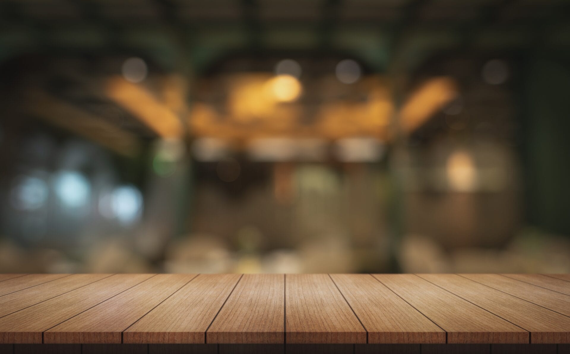 Wooden table with blurred restaurant background